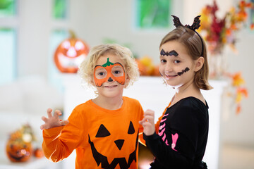 Child in Halloween costume. Kids trick or treat.