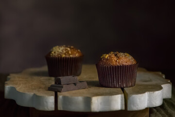 Chocolate muffins sprinkled with nuts