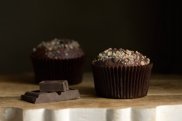 Chocolate muffins sprinkled with nuts