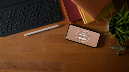 Mock up horizontal smartphone screen on worktable