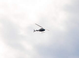 Helicopter flying high over Sydney harbour Australia