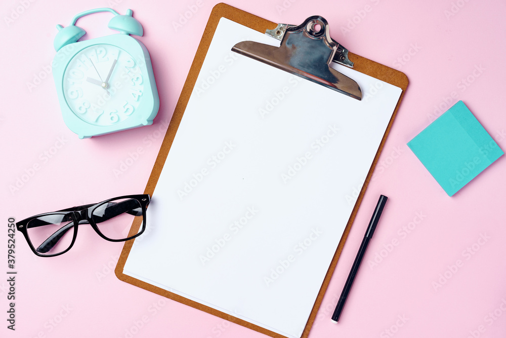 Sticker Clipboard with blank sheet of paper and alarm clock on pink