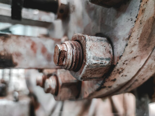 close up of a rusty bolt and nut, screws