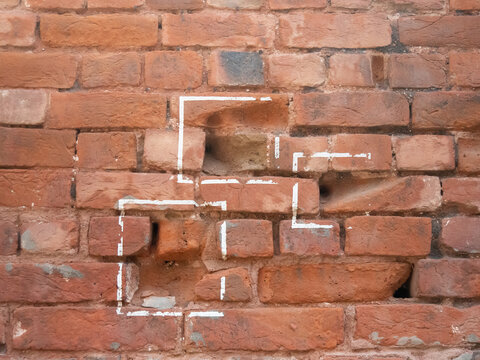 three bullet marks on a wall at jallianwala bagh in amritsar