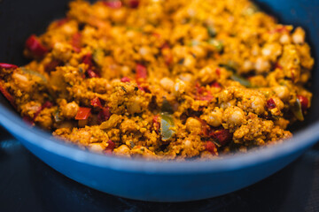 plant-based food, vegan chickpeas red pesto stew with cous cous and capsicums and spices