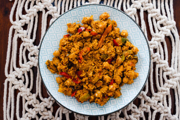 plant-based food, vegan chickpeas red pesto stew with cous cous and capsicums and spices