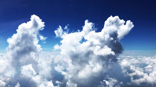 Blue sky white clouds. Puffy fluffy white clouds. Cumulus cloud scape timelapse. Summer blue sky time lapse. Dramatic majestic amazing blue sky. Soft white clouds form. Cloud time lapse background .