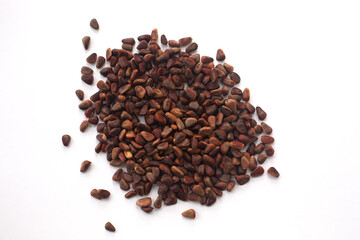 Heap of pine nuts on a white background.