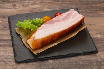 Smoked pork breast with salad leaves