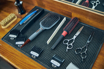 HIgh-quality barbering equipment setup on a table in a barbershop