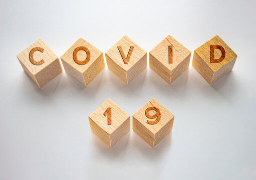 Wood Blocks With The Text: Covid 19. Concept Coronavirus, Pandemic, Update.