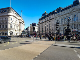 London city piccadilly circus regent street road street cross traffic light sunshine sunny day blue...