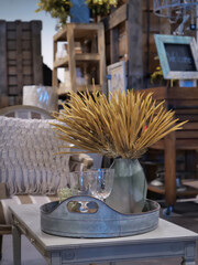 Decorative leaves in a table top vase.
