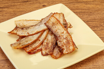 Roasted juicy bacon in the plate