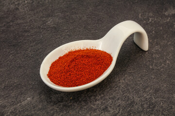 Dry paprika powder in the bowl