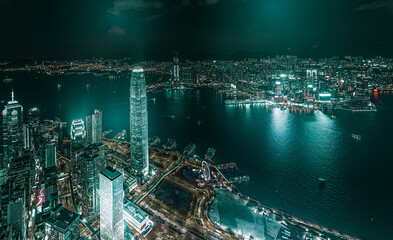 Top view aerial photo from flying drone of a developed metropolitan city in Hong Kong with office skyscrapers.