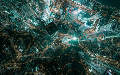 Top view aerial photo from flying drone of a developed metropolitan city in Hong Kong with office skyscrapers.