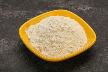Wheat flour heap in the bowl