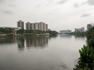 Fototapeta na wymiar suburban city skyline reflected in the river