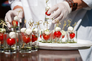 Food catering concept: Various snacks on table, outdoor banquet
