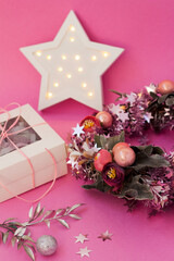 Girly christmas decoration. Floral wreath with baubles. Cute card with lights and gift box. Holiday decor for girl
