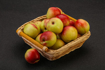Sweet small nectarines in the basket