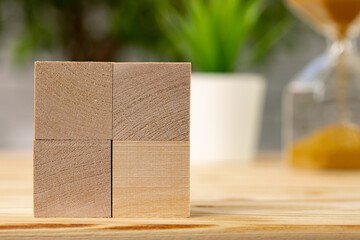 Blank wooden cubes with copy space for your design on office working table