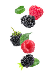 Falling tasty ripe berries on white background