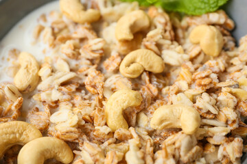 Bowl with tasty sweet oatmeal, closeup