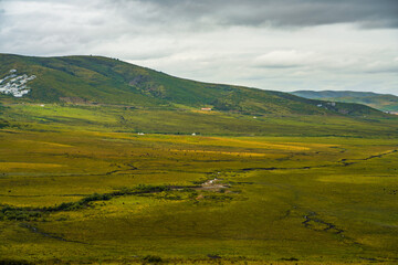 Fototapeta premium The hills and ranch landscape in Ruoergai Grassland, in Sichuan, China.