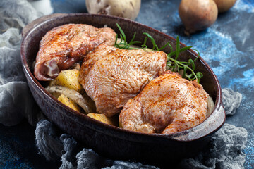 Chicken thighs and potatoes ready for baking