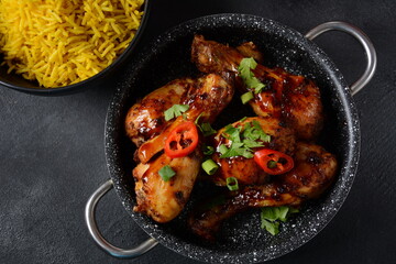 Tandoori chicken with fresh chicken dough and crispy Indian spices and yellow wild rice cooked with curcuma turmeric spice