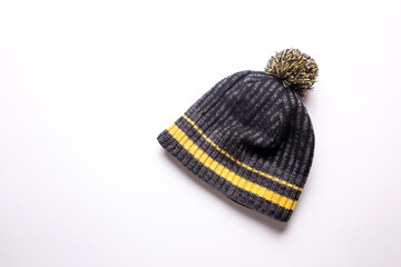 Men's winter hat in gray and yellow on a white background.