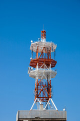 Communications tower with a beautiful blue sky