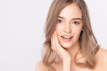 Fototapeta premium Beautiful Young Woman With Clean Fresh Skin on white background, Face care, Facial treatment. Cosmetology, beauty and spa. women portrait.
