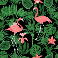 Tropical vector seamless pattern with flamingo bird and orchid flower, banana tree, ravenala tree on black background 