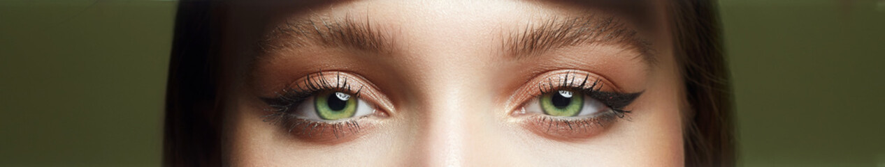 close-up photo of beautiful female green eyes