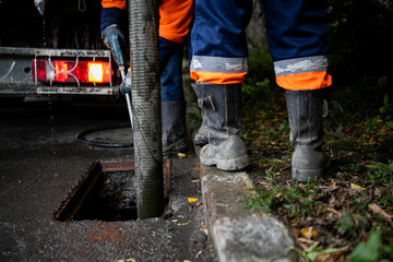 Cleaning storm drains from debris, clogged drainage systems are cleaned with a pump and water