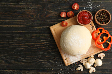 Ingredients for cooking pizza on wooden background