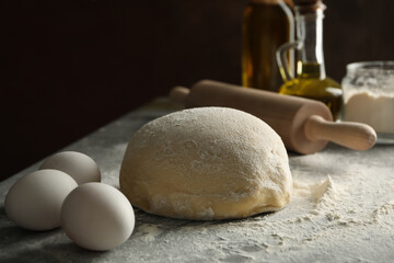 Concept for baking with dough on gray background