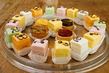Iced mini cakes named Petit four glace. Delicious for a high tea