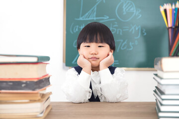 Asian little girl who doesn't want to study