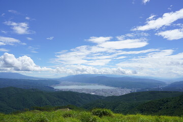Fototapeta premium Lake Suwa and Mt. Fuji overlooking the Takabotchi plateau in fine weather