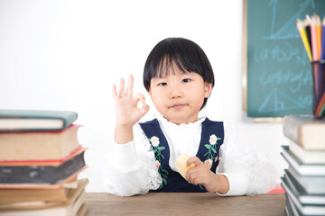 Little girl with OK gesture