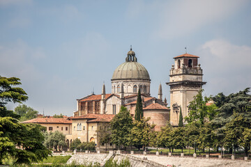 Fototapeta na wymiar View of the Adige embankment and the Church of Saint Stephen in Verona, Veneto, Italy