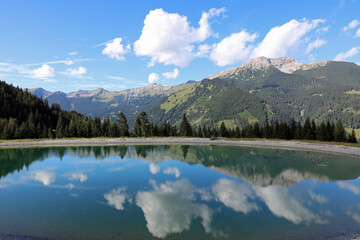 Fototapeta na wymiar Water Reservoir at European Alps. Tyrol. Austria