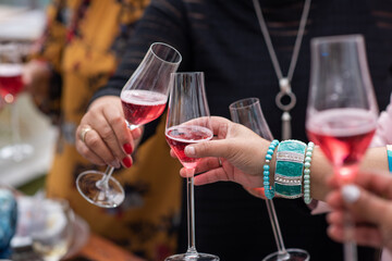 Group of people clanking glasses during event