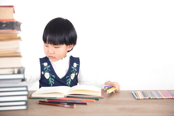 Four year old girl is studying