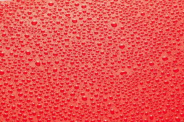 Drops water on the clear glass red background. Water condensation