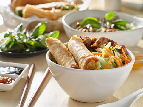 vietnamese bun thit nuong with spring rolls and grilled pork